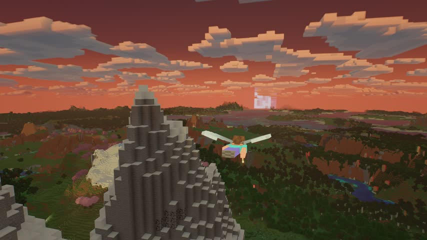 Flying with an elytra over mountains at sunset
